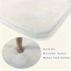 A white microfiber memory foam cushion mat is shown in a close-up view.