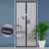 Automatic mosquito net curtain installed on a glass door, showing the netting and a hanging light.
