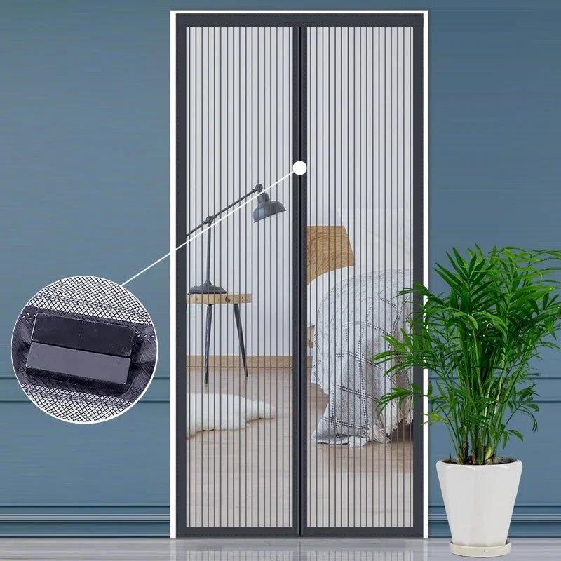 Automatic mosquito net curtain installed on a glass door, showing the netting and a hanging light.