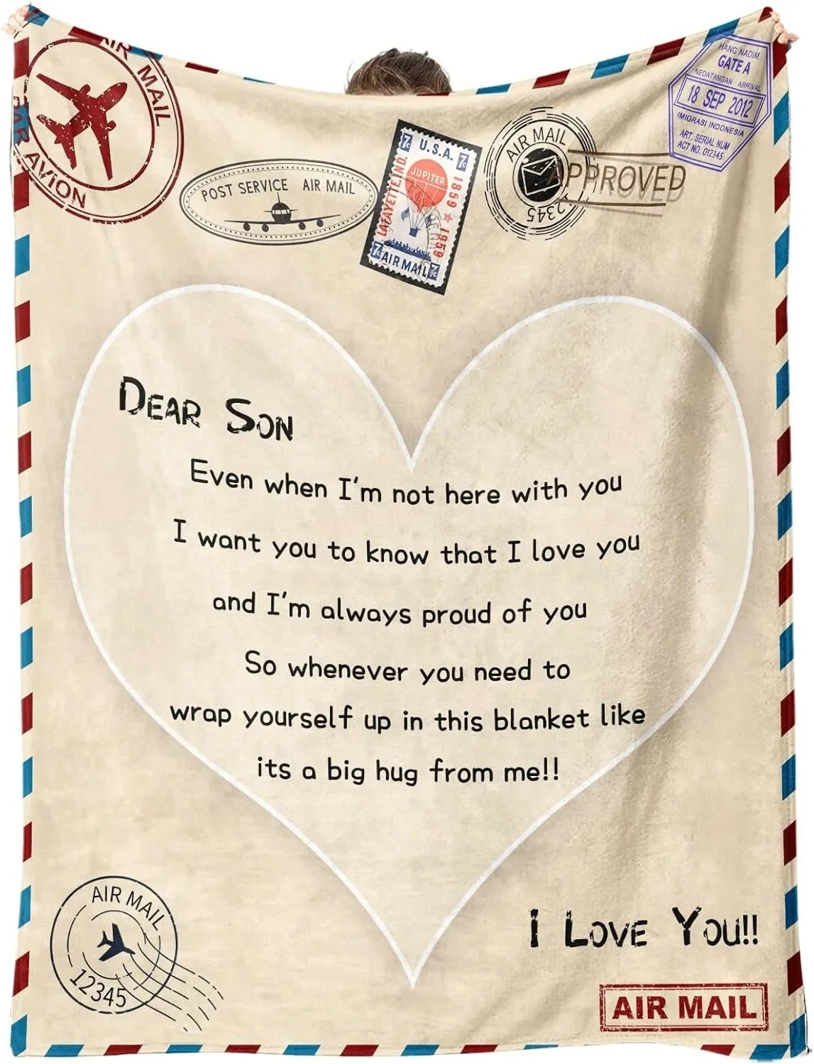 A beige knit blanket featuring a heart design and text saying Dear Son I love you and I'm always proud of you