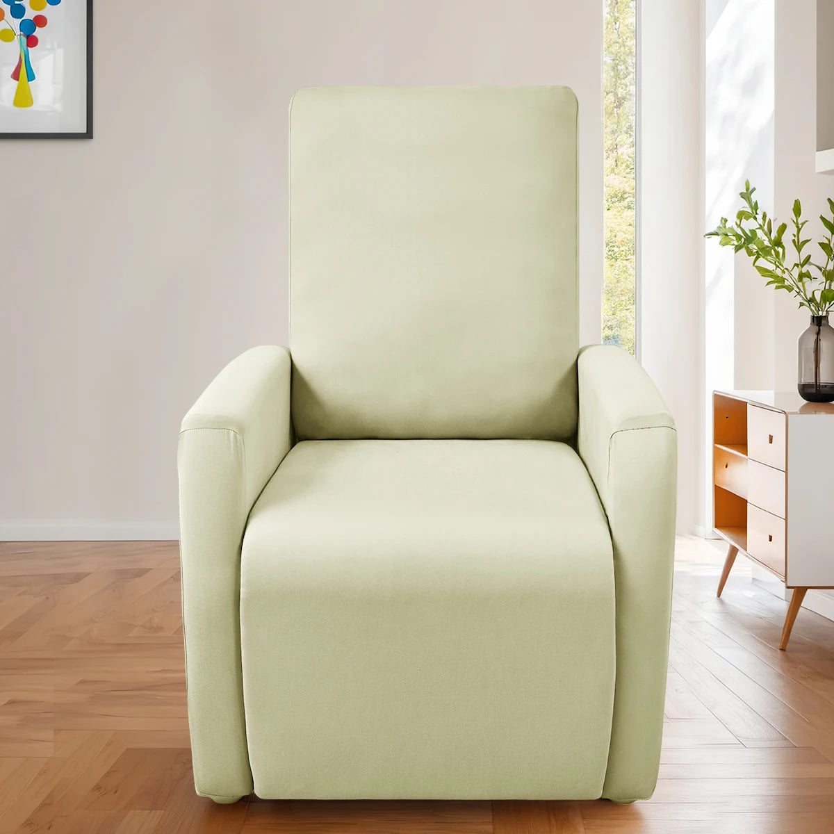 A light beige milk silk stretch sofa cover set for accent chairs displayed in a bright room.