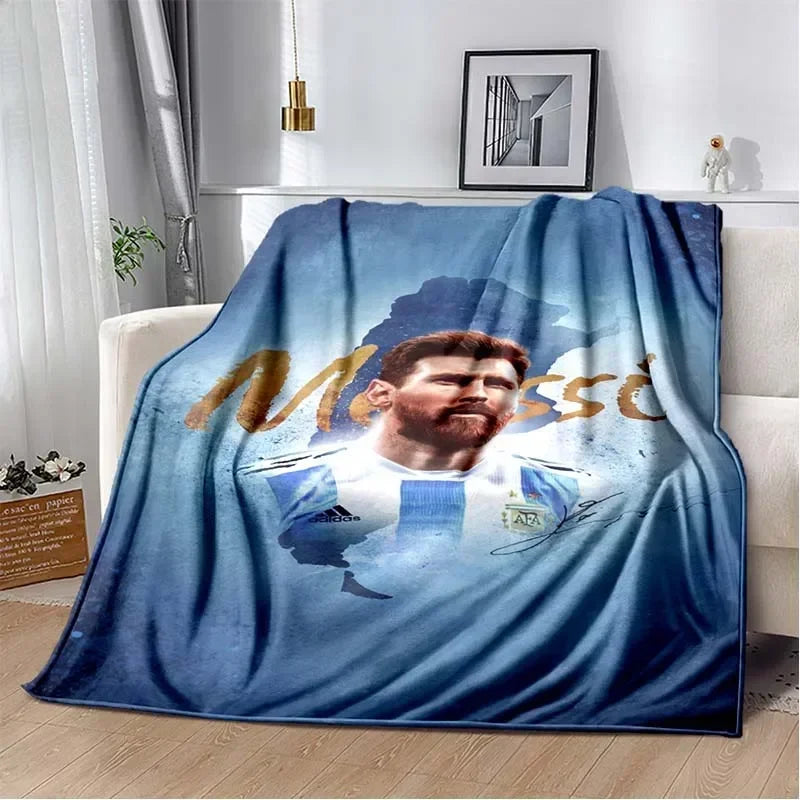 A blue and white blanket featuring a portrait of a man with a beard, suitable for a cozy sofa bed.