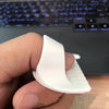 A hand holds a white plastic sewing guide tool with 3mm spacing for DIY crafting.