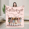 A pink fleece throw blanket featuring illustrations of K-Pop idols and a star design.