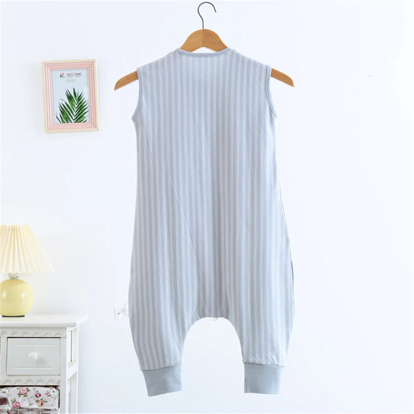 A light blue and white striped cotton sleeping bag for children hanging on a wooden hanger.