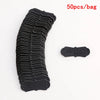 A stack of black PU leather embossed tags for handmade crafting, showing the texture and design.