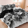 A black and white artistic print of a skull with floral elements on a duvet cover.