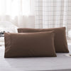Three solid brown microfiber pillow covers are displayed on a light gray surface.
