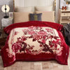 A deep red weighted blanket featuring a large floral pattern on a cream background.