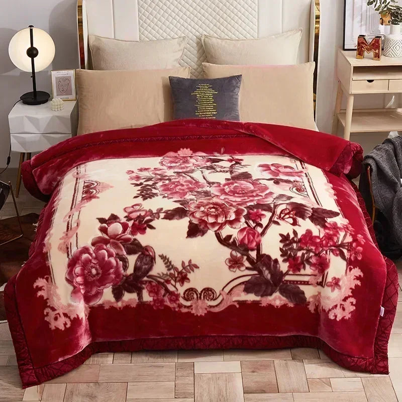 A deep red weighted blanket featuring a large floral pattern on a cream background.