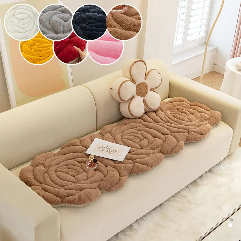 A beige sofa features a brown textured mat with a floral embellishment and color swatches.