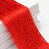 A long, bright red thread curtain tie-back is displayed next to a white box.