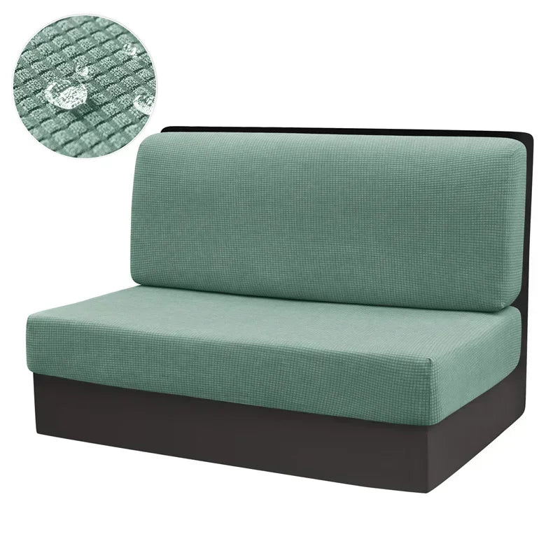 A teal stretch sofa and chair cover with a textured fabric detail shown next to a swatch.