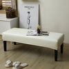 A beige waterproof stretch dining bench cover is displayed on a white bench in a bright room.