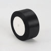 A roll of black satin ribbon measuring 4cm for crafts and gift wrapping.