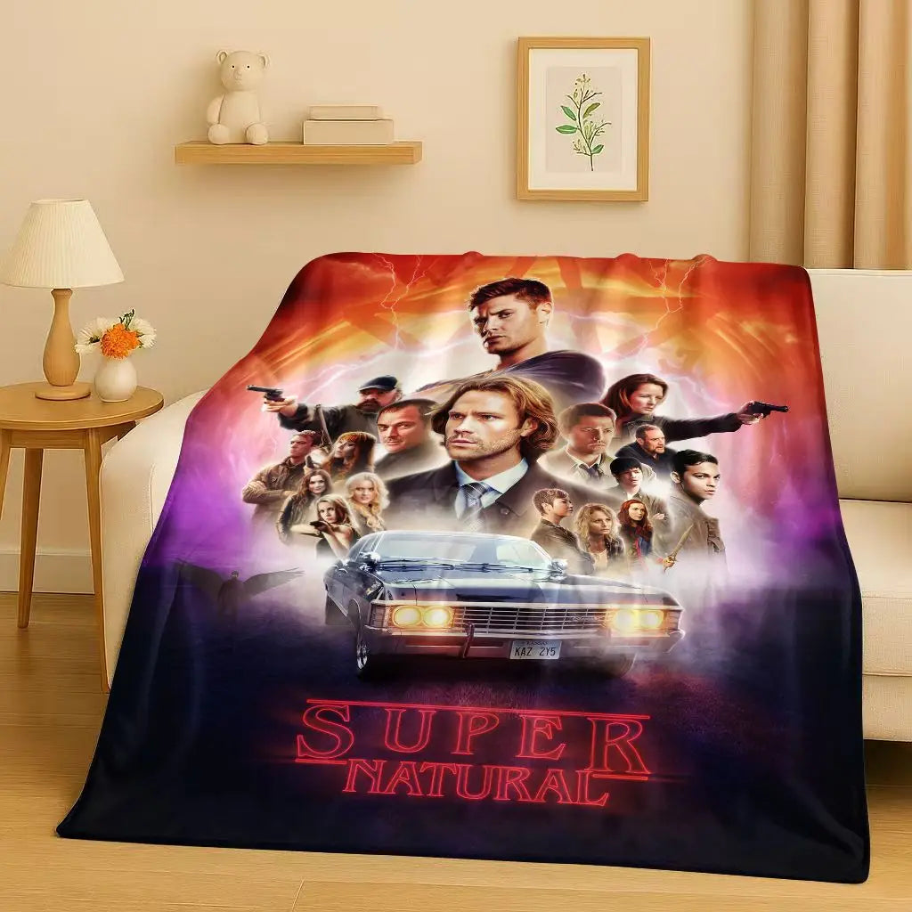 A blanket featuring a movie poster of characters in an intense scene with the title Super Natural