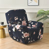 A navy blue floral print recliner and sofa slipcover set displayed on a light wood floor.