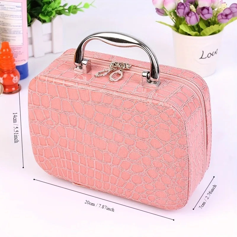 A pink quilted portable sewing kit case with a silver handle and storage for needles and thread.