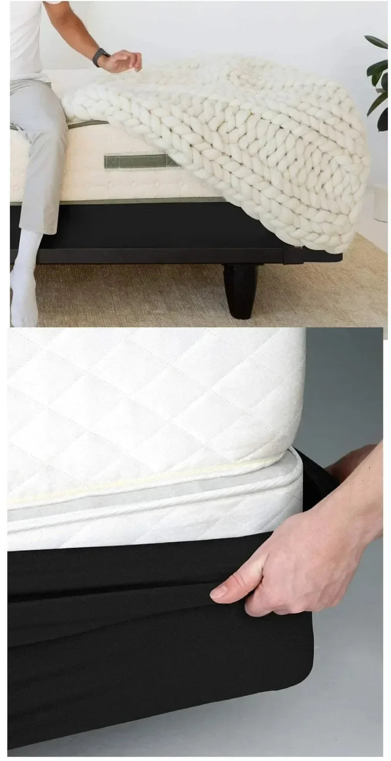 A close-up of a white knitted box spring protector cover being placed over a black box spring.