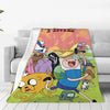 A colorful cartoon-themed throw blanket featuring characters from an adventure show