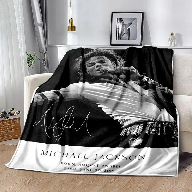 A black and white portrait of Michael Jackson printed on a flannel throw blanket.