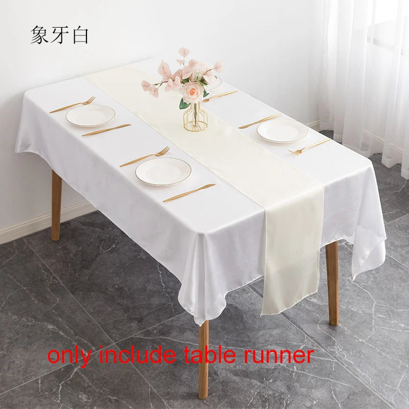 White satin table runner set with plates and chopsticks for dining decor