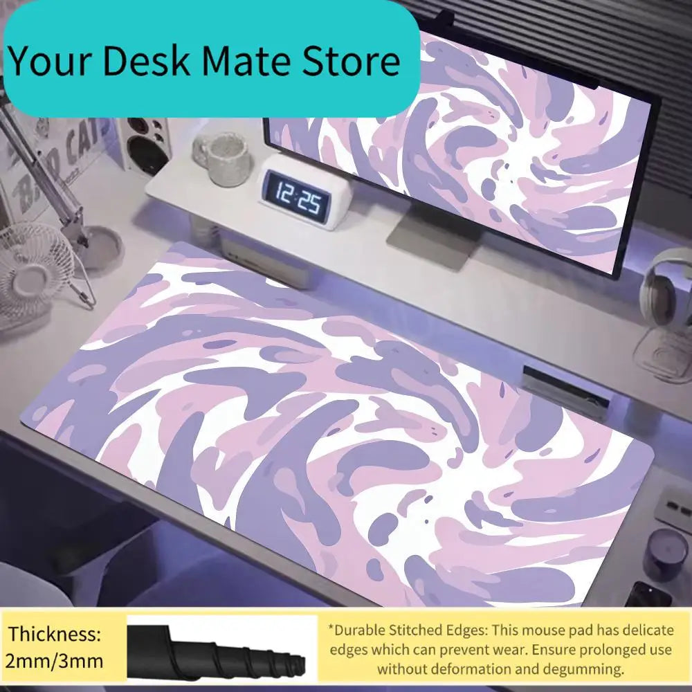 A purple and pink swirling art design mouse pad displayed on a desk with a digital clock.