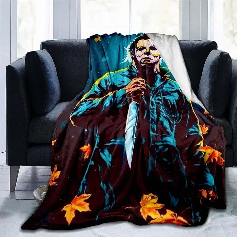 A dark horror-themed throw blanket featuring a figure resembling Michael Myers in blue and yellow tones.
