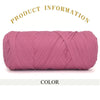 A tightly wound skein of thick pink polyester blended yarn for crafting.