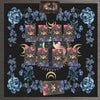 A mat featuring a floral design with tarot cards centered around a crescent moon and celestial elements.