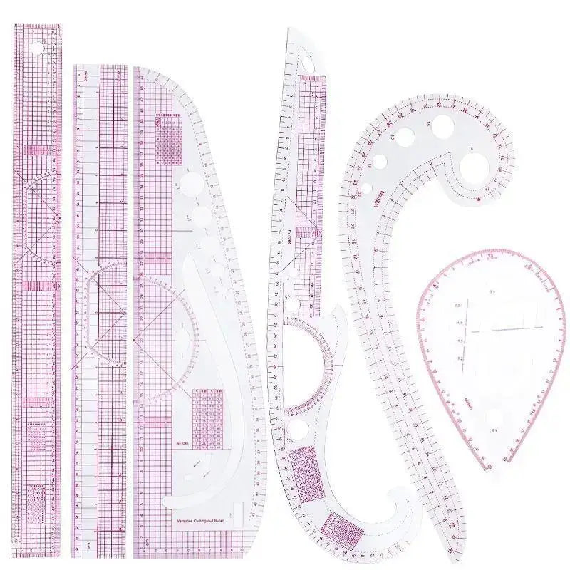 A set of precision sewing rulers featuring French curve templates and various measuring scales.