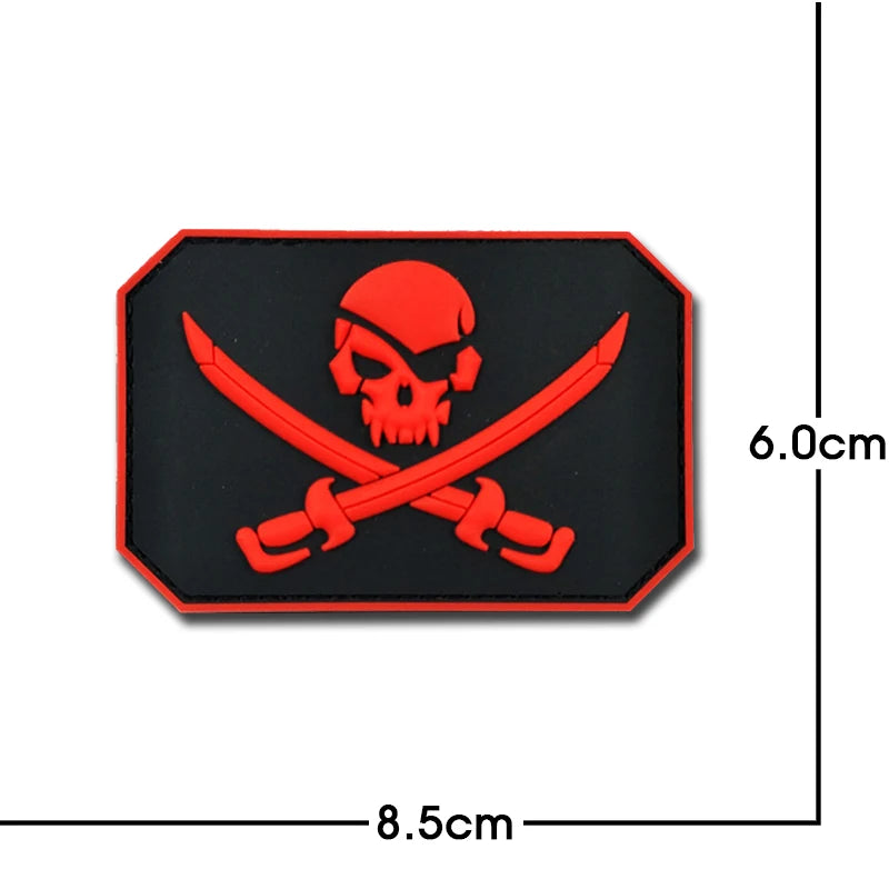 A red pirate skull and crossbones embroidery patch with a black background and an octagonal shape.
