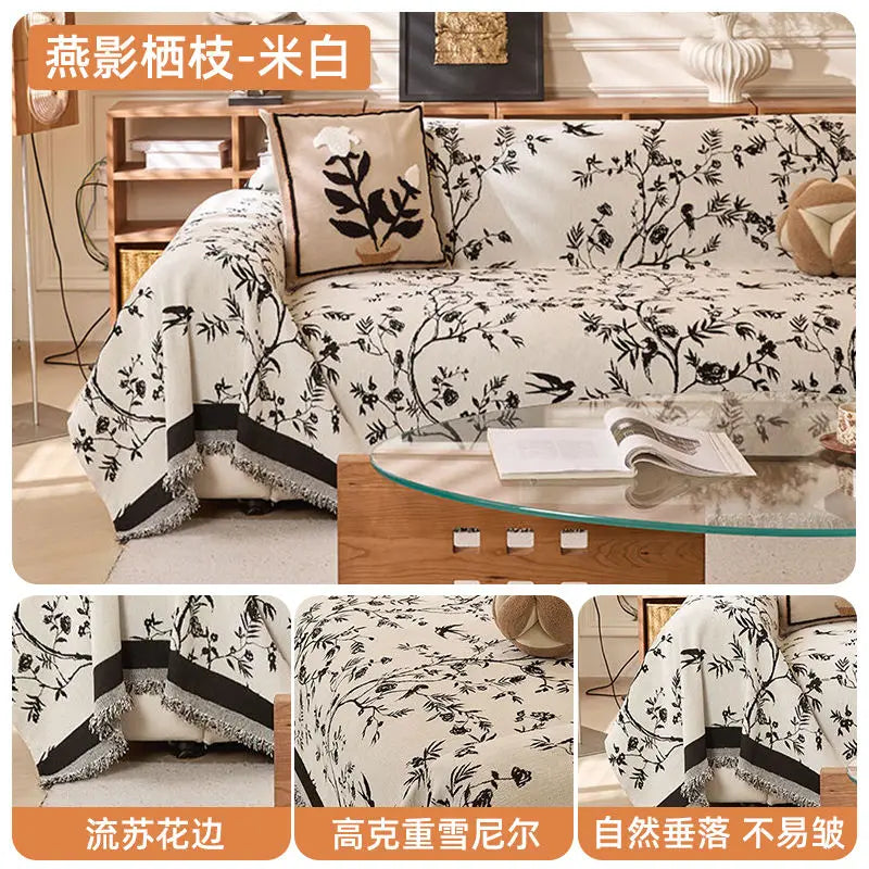 White floral pattern chenille sofa slipcover displayed on a wooden surface.