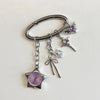 Silver adjustable necklace featuring a star-shaped pocket watch charm with a purple face and gemstone accents.