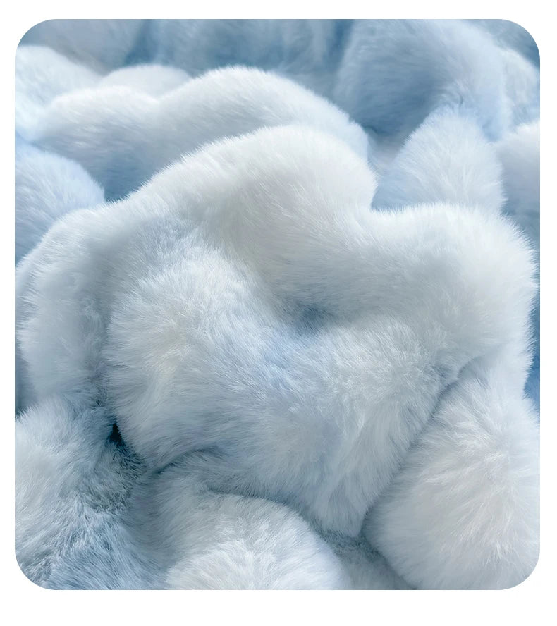 Close-up of soft light blue faux rabbit fleece fabric texture.