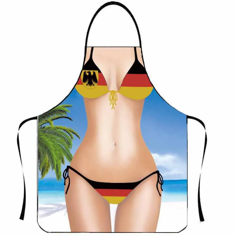 A black apron featuring the German flag design worn by a person in a tropical setting.