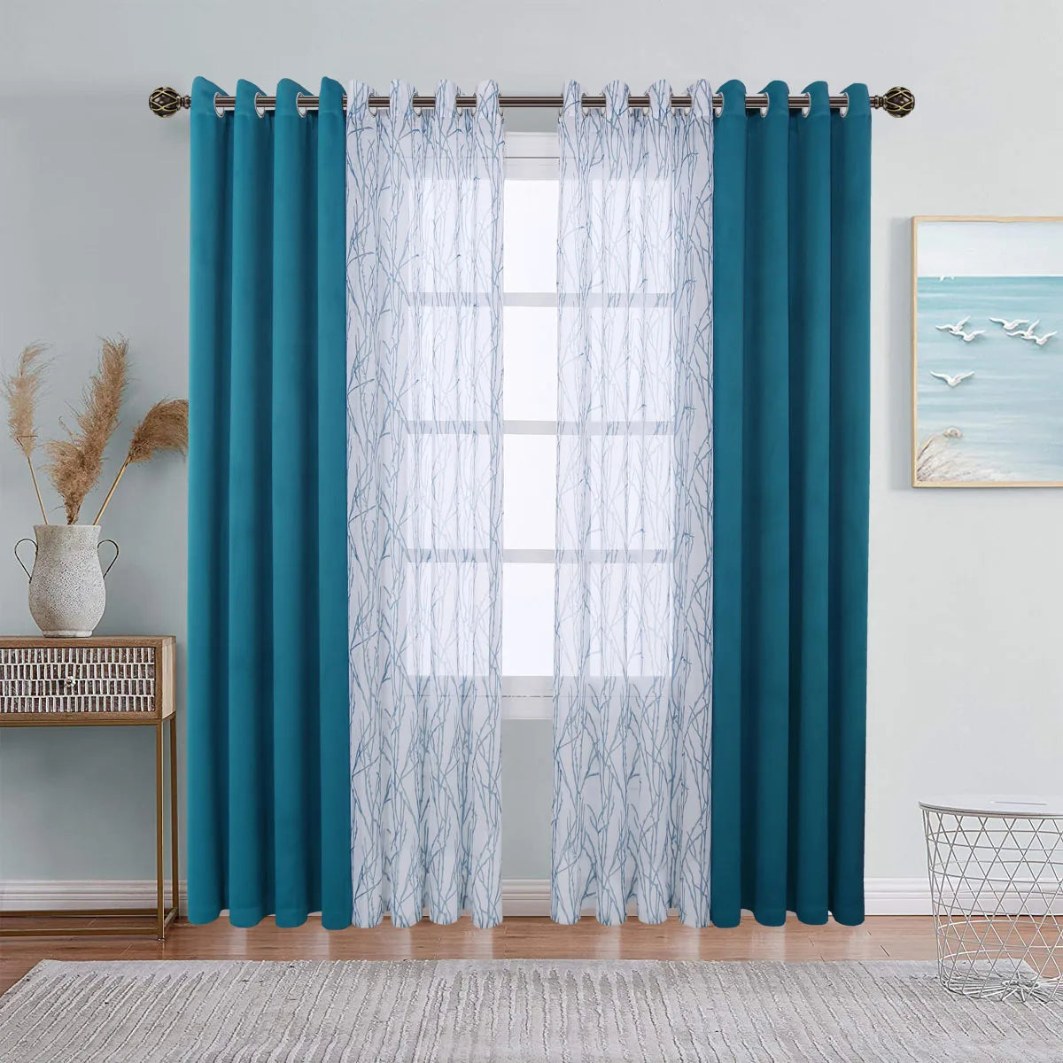 A set of teal blue curtains featuring sheer and blackout window drapes hanging in a window.