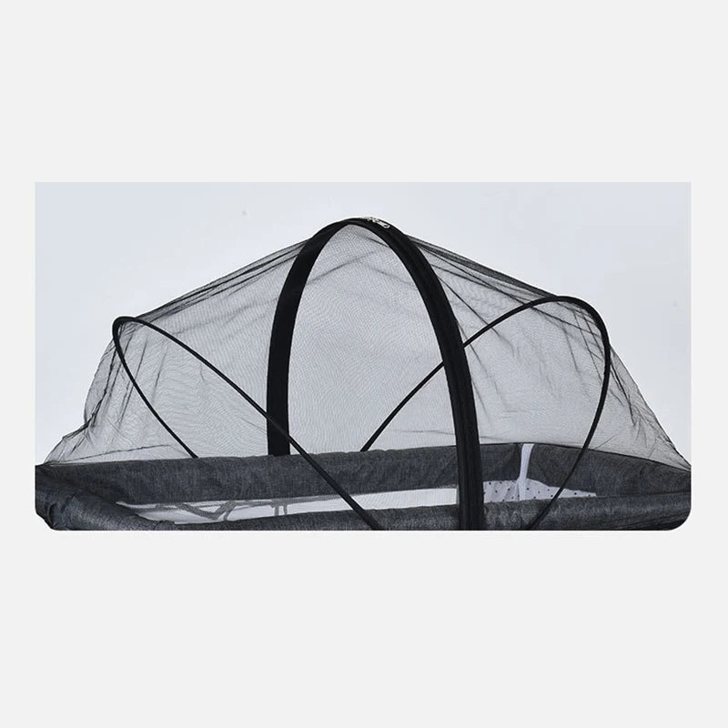 Black mesh mosquito net canopy stretched over a frame, likely for an infant cot.