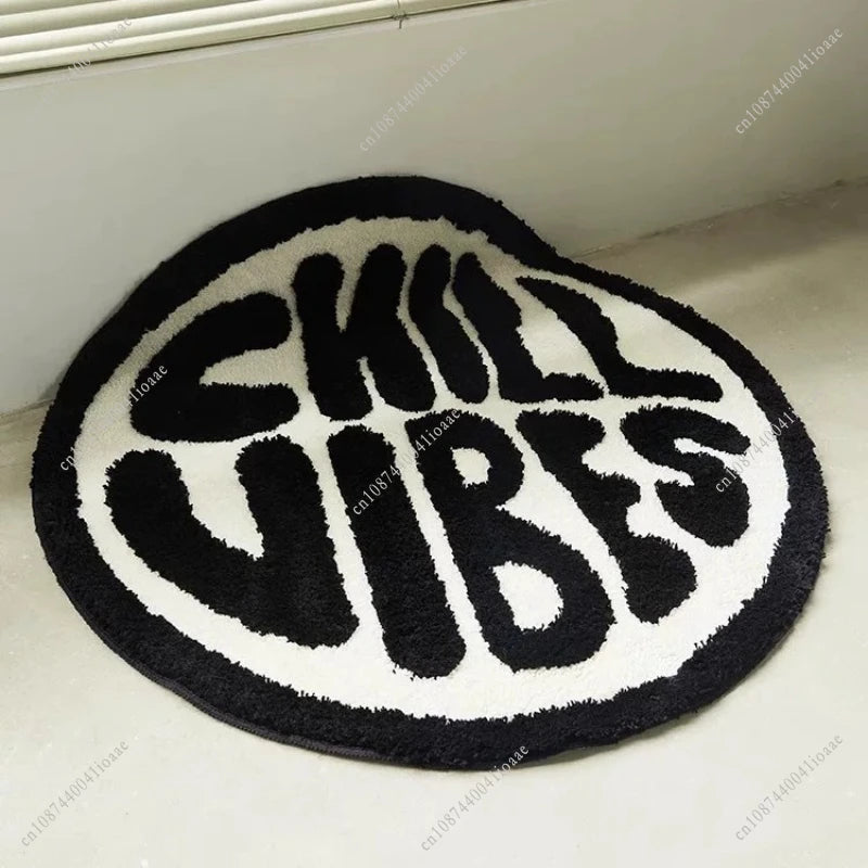 Black and white round floor mat with the text SKILL VIBES in a bold font
