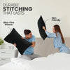 A woman is shown using a durable stitching technique on a black pillow cover in a bedroom setting.