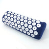 A dark blue acupressure relief mat and pillow set covered in white dots.