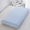 Light blue ice silk cooling pillowcase resting on a white surface.
