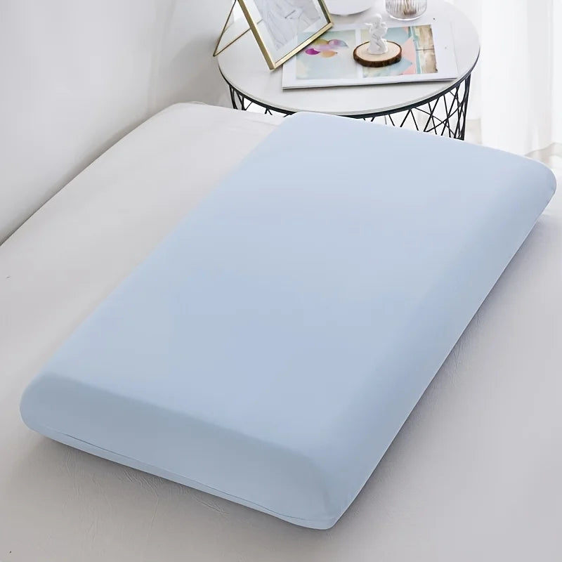 Light blue ice silk cooling pillowcase resting on a white surface.