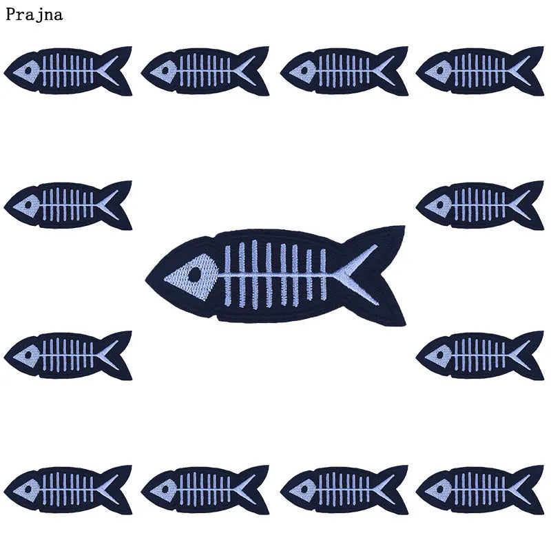 A set of twelve embroidered fish-shaped patches in navy blue for DIY punk embroidery on clothing.