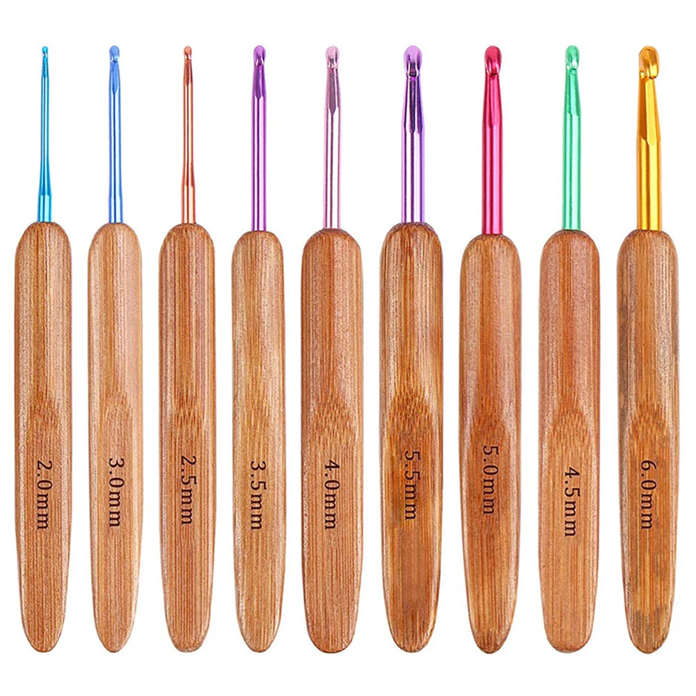 A set of six bamboo knitting and crochet needles in various sizes and colors.