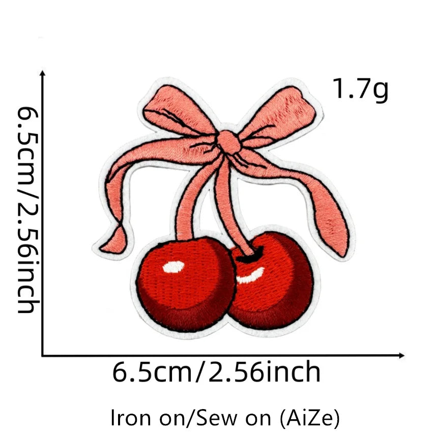 A set of two red cherry embroidered fruit patches measuring 1.7g, designed for iron-on sewing.