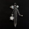 Silver star-shaped pocket watch keychain with a chain and a round clock face.