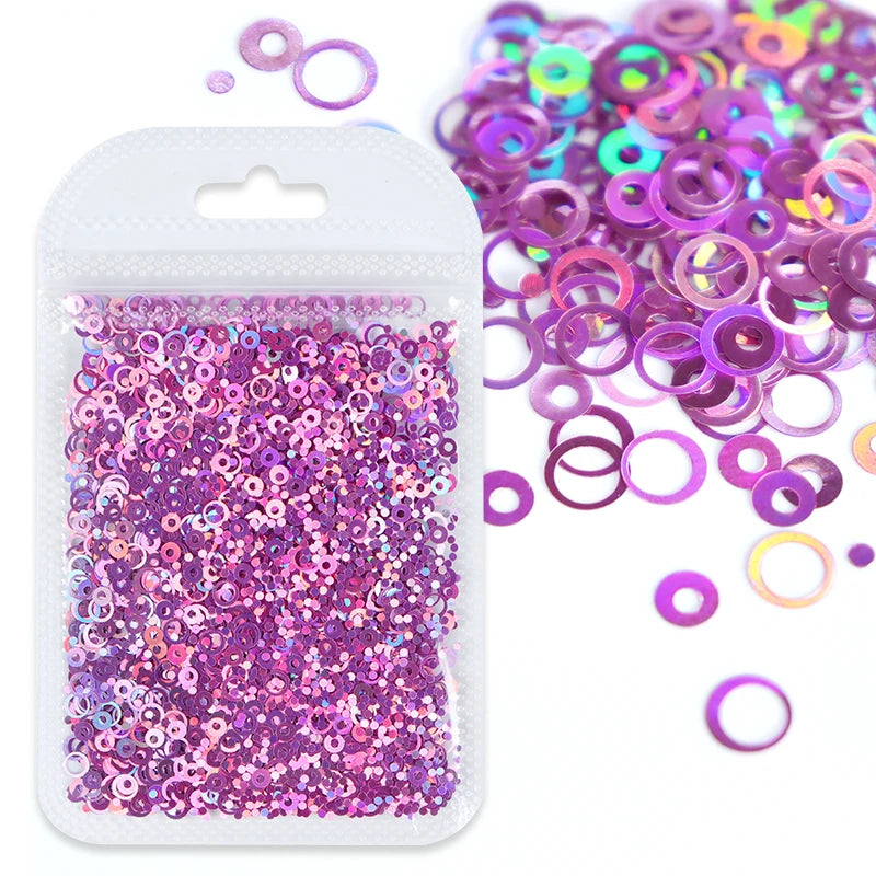 A clear plastic bag filled with purple and pink resin glitter filler for epoxy art