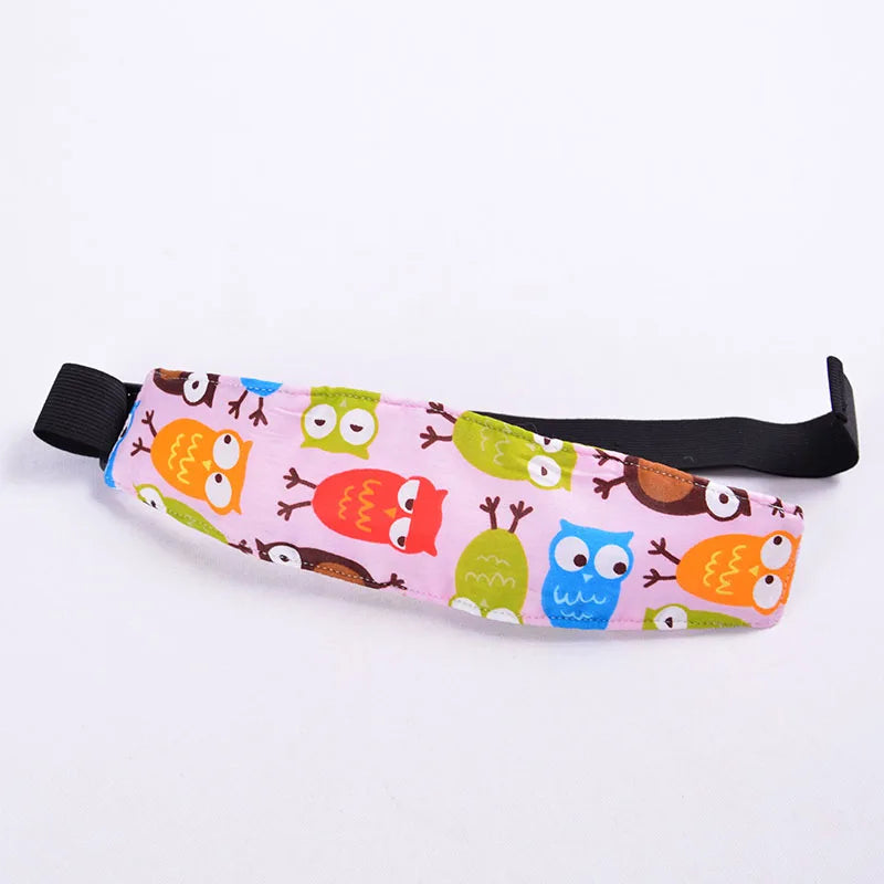 Pink fabric head support for a baby car seat featuring colorful animal faces