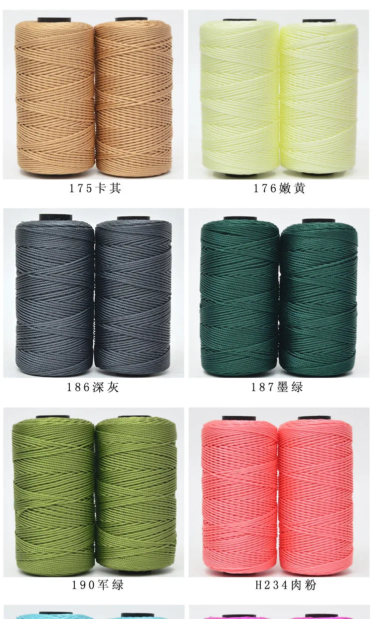 A collection of spools of hand knitting and crochet cord in various colors including beige, yellow, gray, green, and pink.